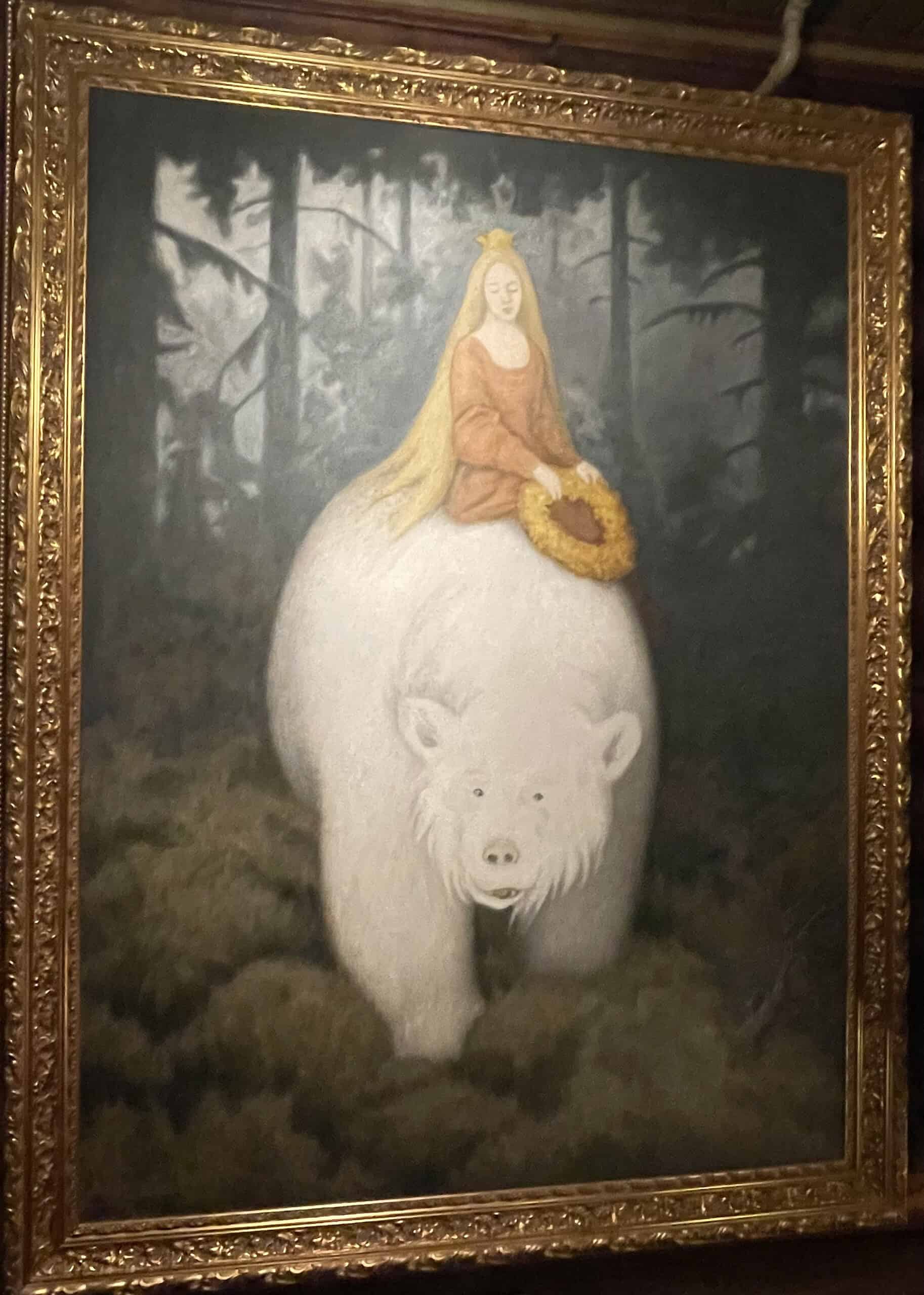Gemälde mit Eisbär und darauf reitender Prinzessin.