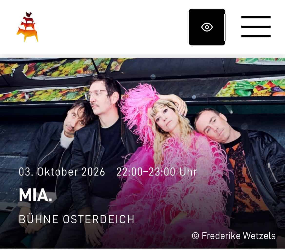 Webseite zur Feier mit Bild von Popsängerin MIA, die auftritt.